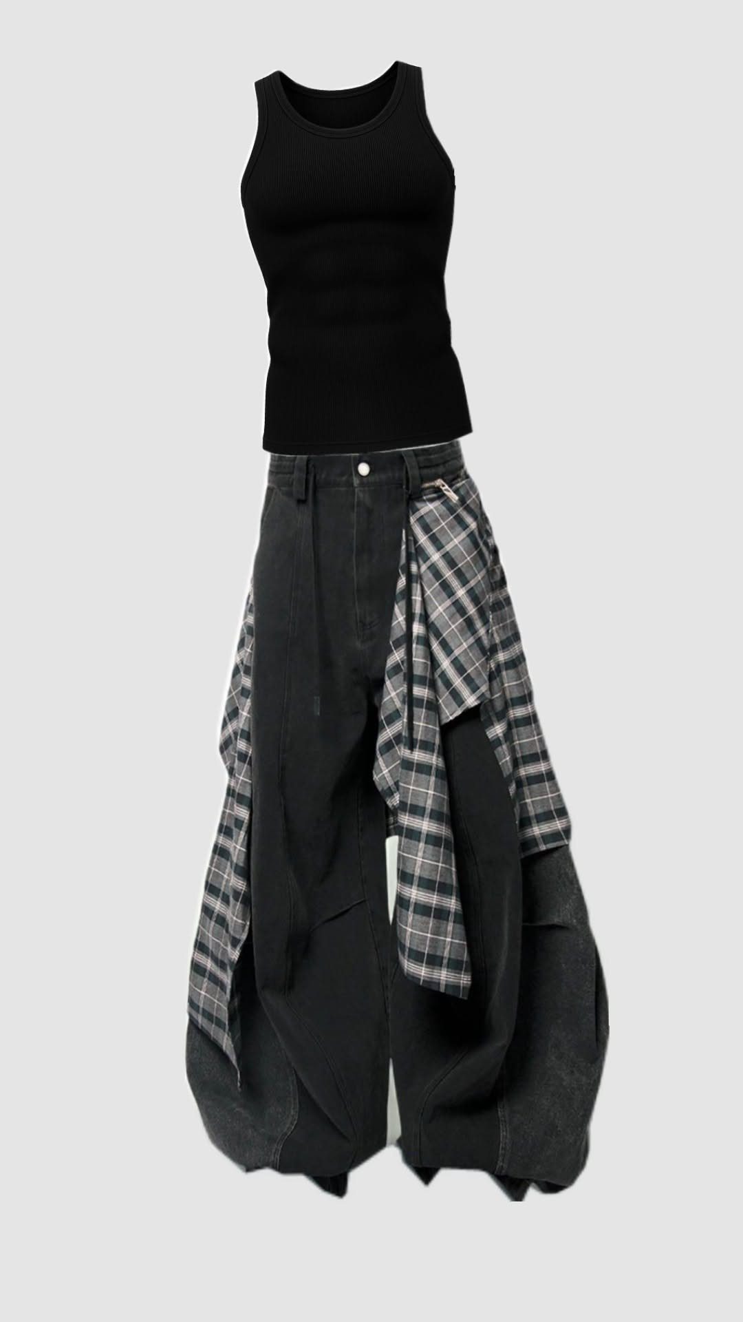 Black crop top, baggy black trousers, and a grey plaid flannel shirt tied around the waist.